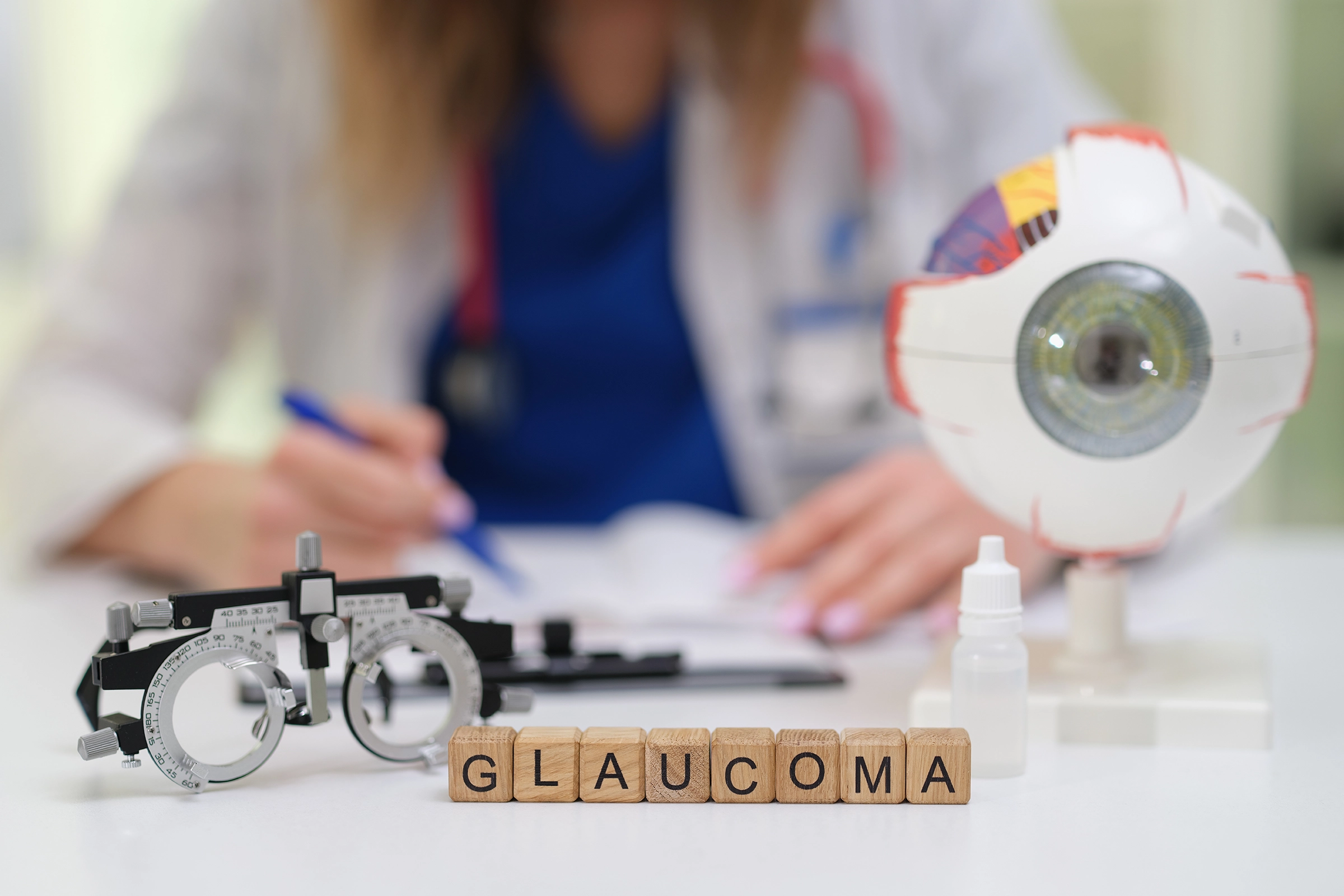 A medical professional at work with the word “glaucoma” spelt out