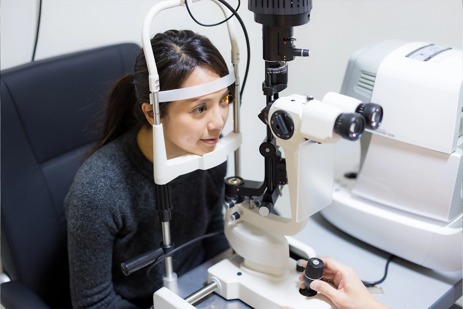 A patient receiving an eye exam during an ophthalmologist consultation